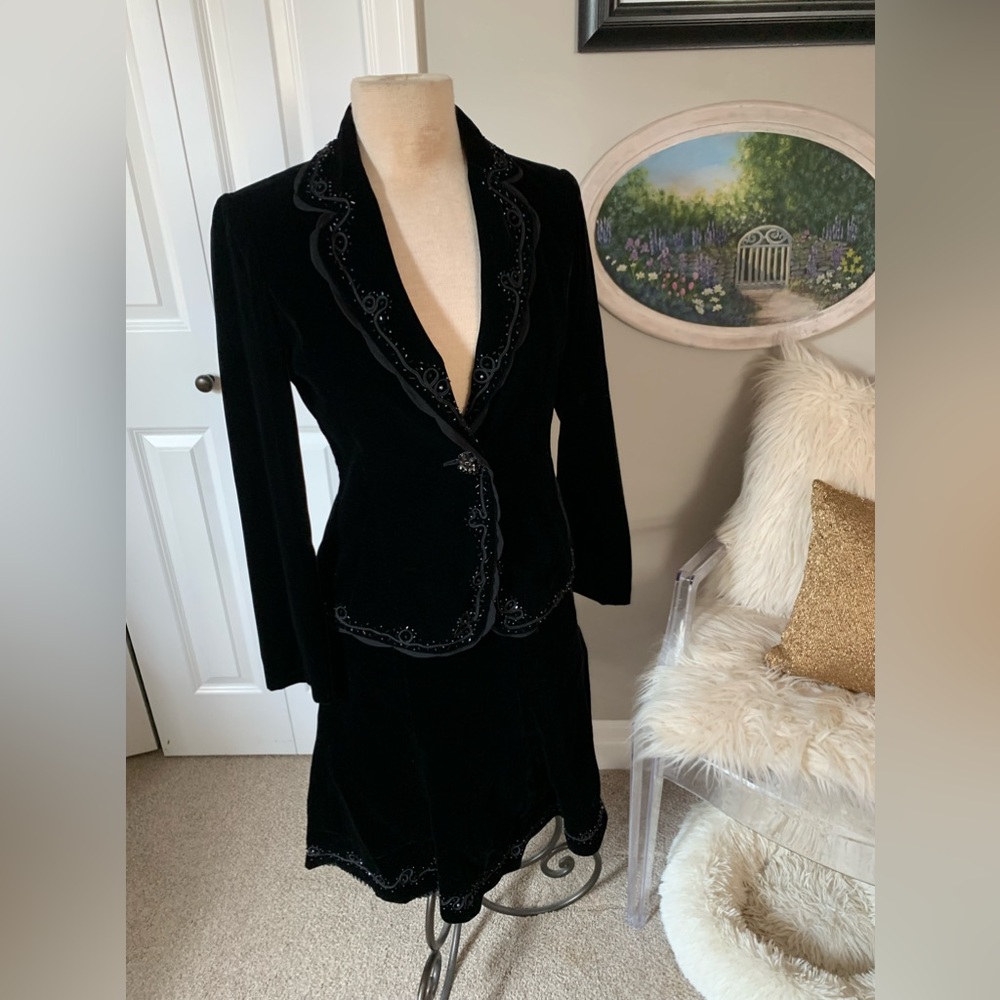 Exquisite cocktail suit in velvet like fabric with subtle attention to detail.